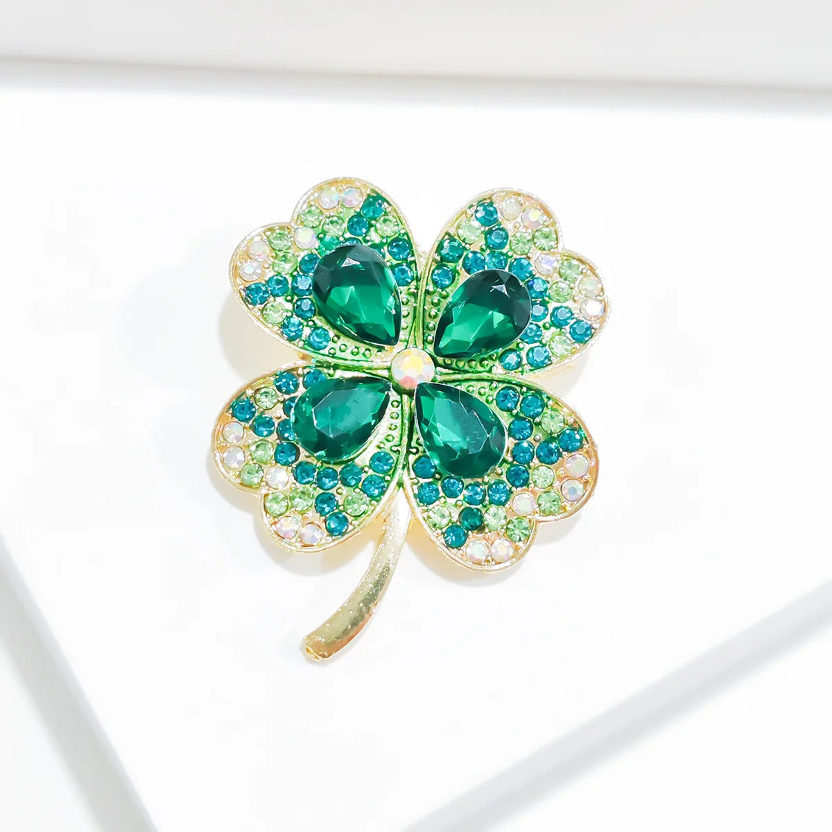 Cross border popular imitation emerald rhinestone four leaf clover brooch chest flower retro brooch Lootquake LLC  Techno geeks